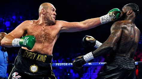 Tyson Fury defeats Deontay Wilder to retain WBC heavyweight .